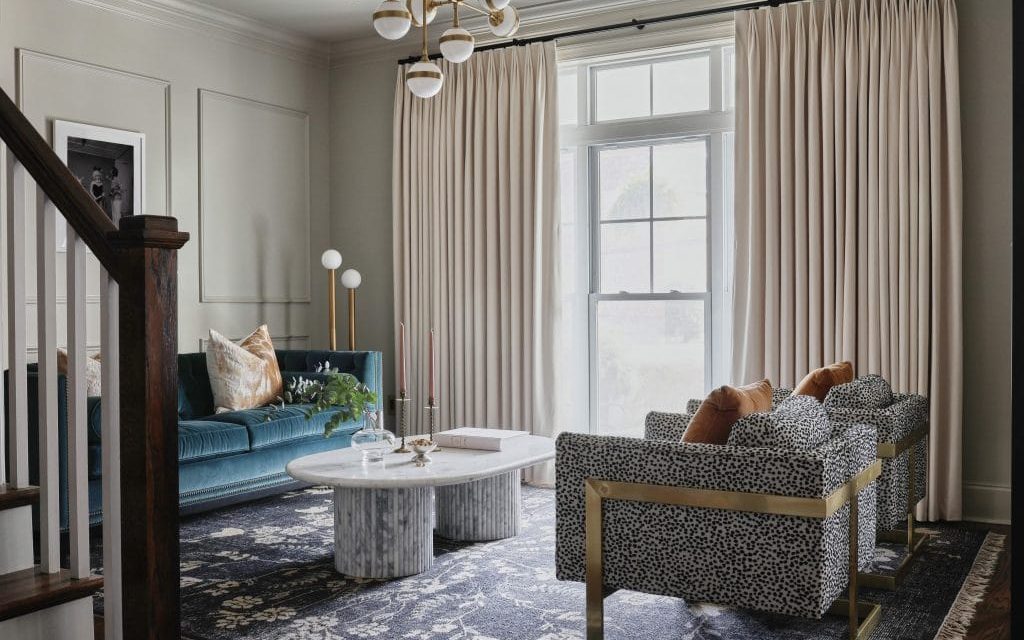 Elegant renovated living room with styled furniture and warm lighting