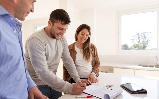 Homeowners reviewing renovation loan and warranty paperwork